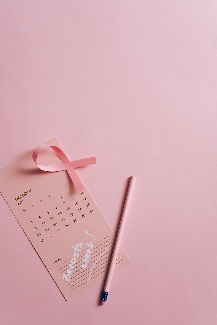 close up shot of a pink ribbon on a calendar